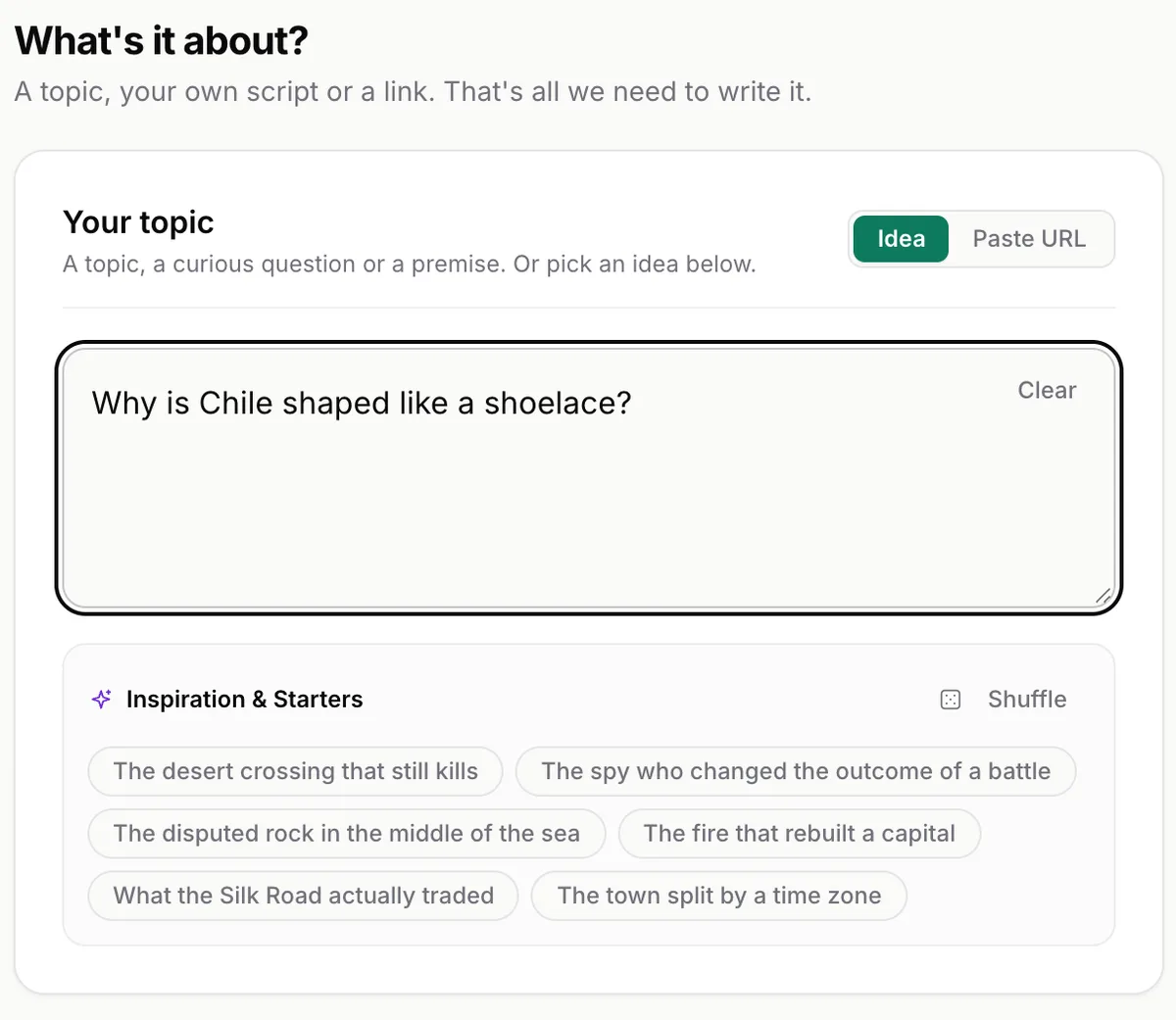 The topic step in the Unfaced studio: the idea 'Why is Chile shaped like a shoelace?' typed in, with starter ideas underneath.